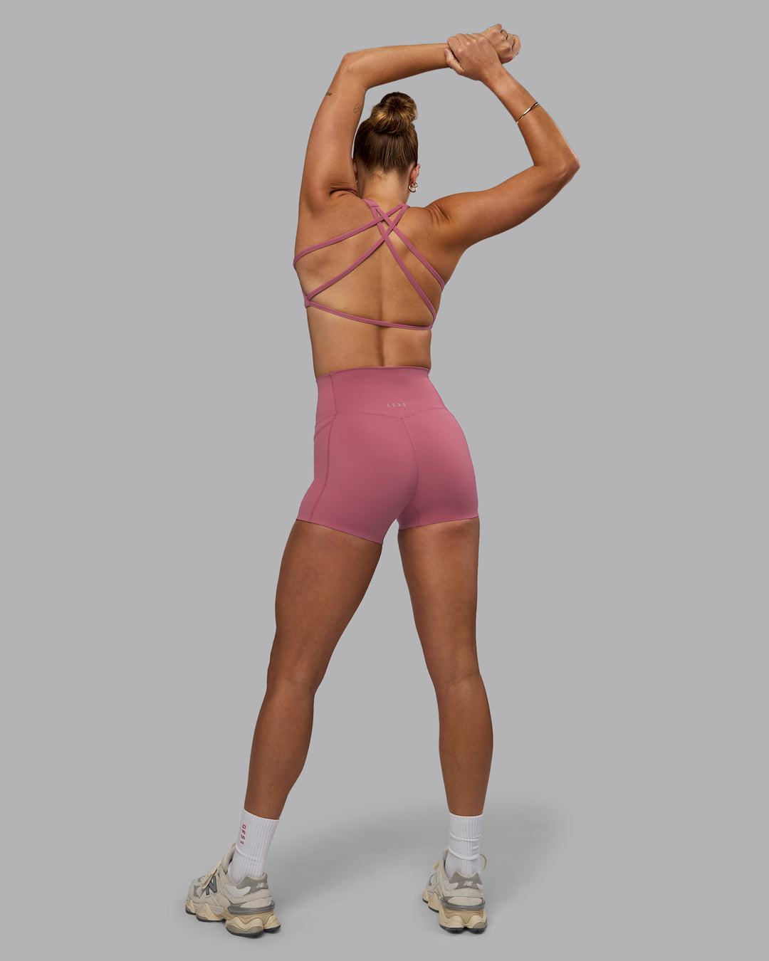 Woman wearing Aspire Sports Bra - Mauve Haze