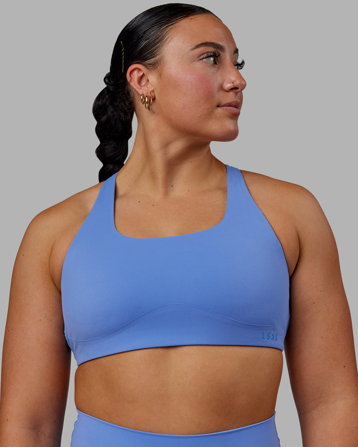 Woman wearing Aspire Sports Bra - Ultramarine
