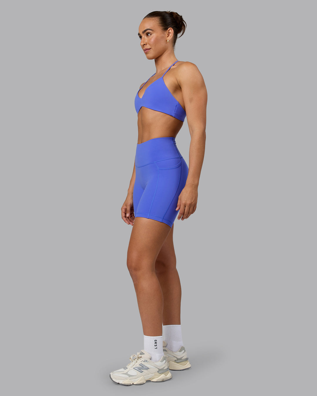 Woman wearing Aura Sports Bra - Baja Blue