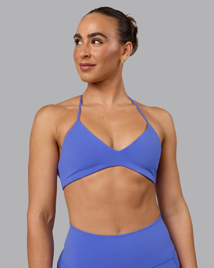 Woman wearing Aura Sports Bra - Baja Blue
