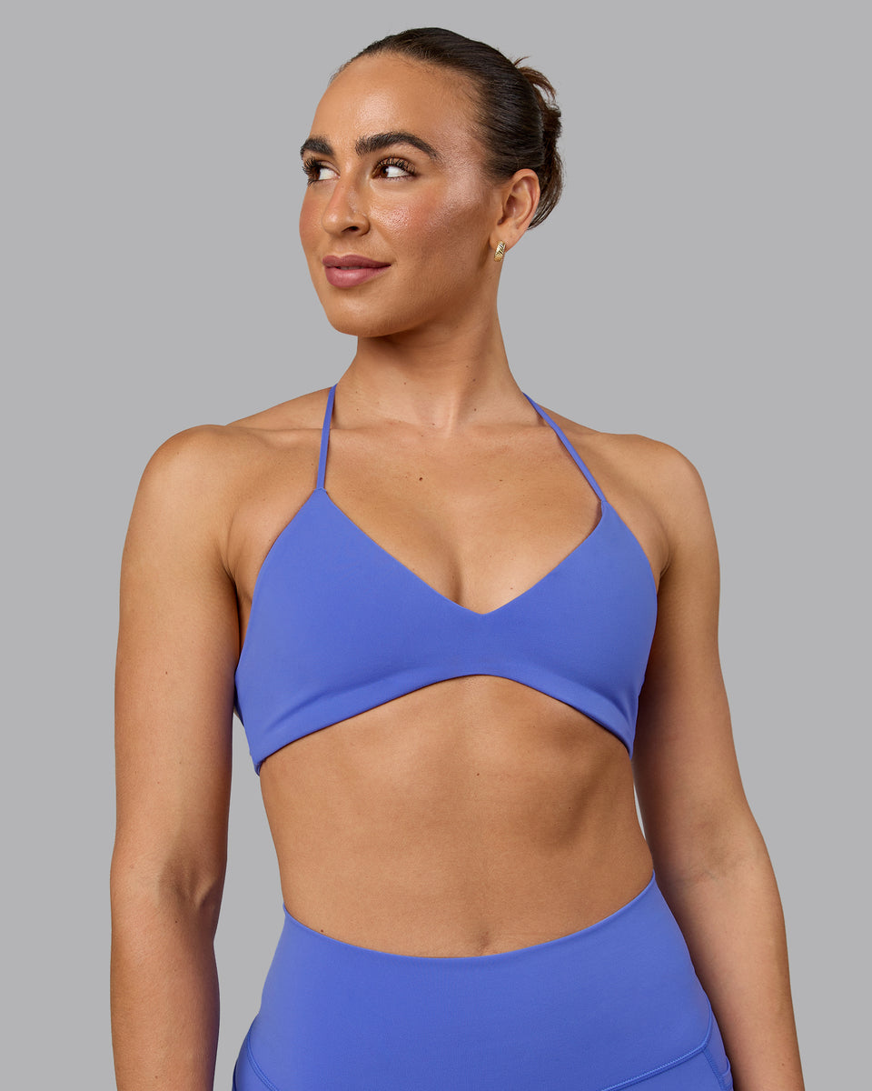 Woman wearing Aura Sports Bra - Baja Blue