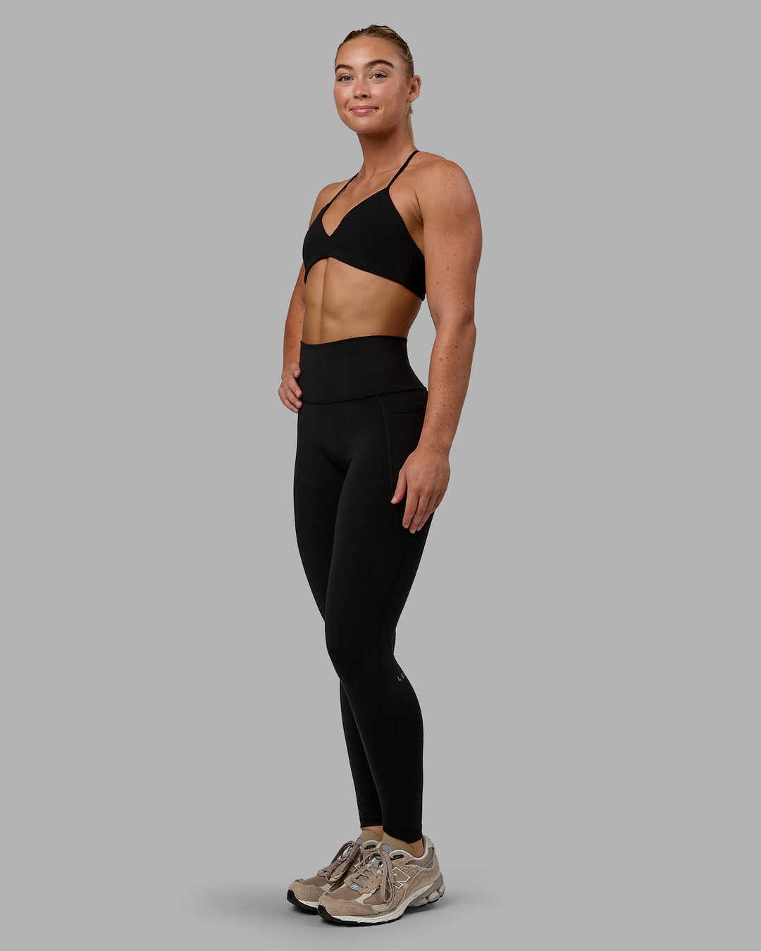 Woman wearing Aura Sports Bra - Black