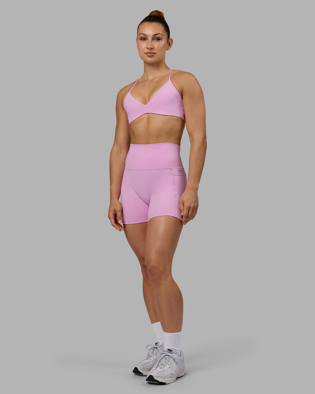 Woman wearing Aura Sports Bra - Pastel Orchid