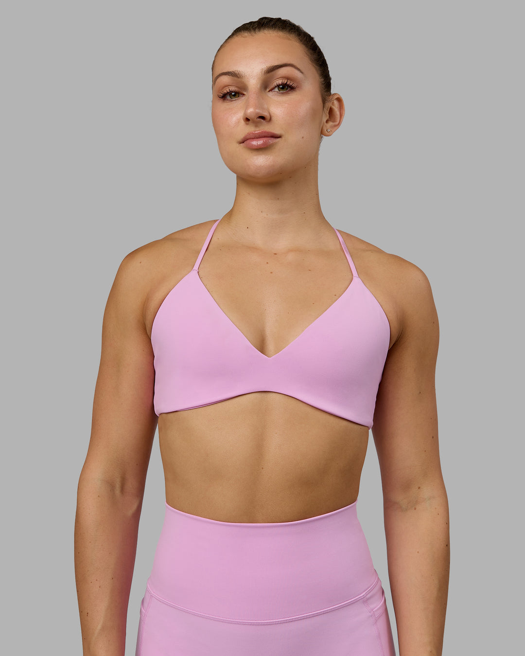 Woman wearing Aura Sports Bra - Pastel Orchid