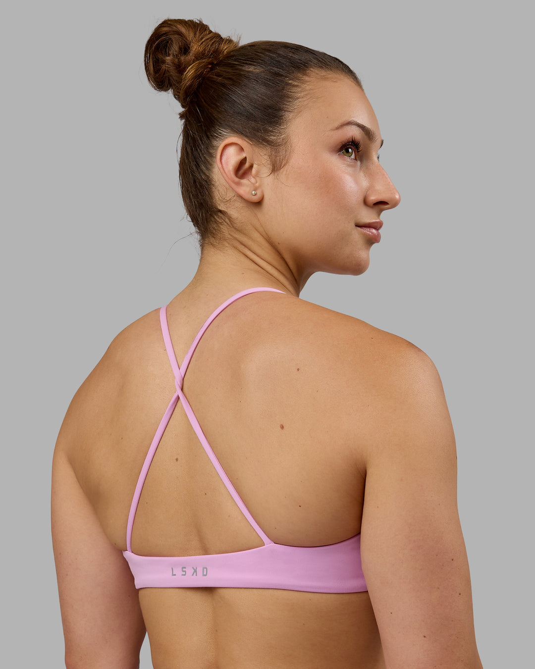 Woman wearing Aura Sports Bra - Pastel Orchid