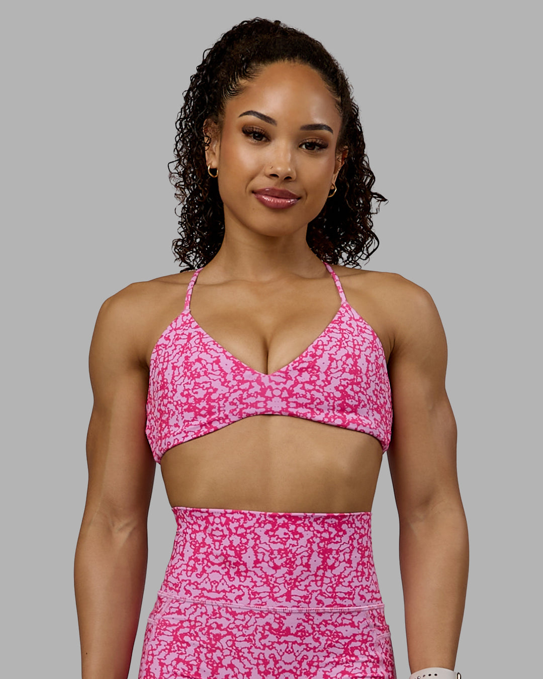 Woman wearing Aura Sports Bra - Patina-Ultra Pink