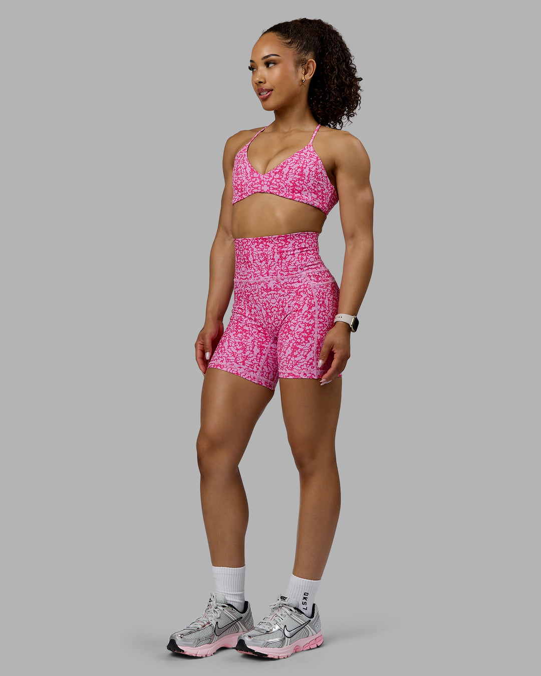 Woman wearing Aura Sports Bra - Patina-Ultra Pink