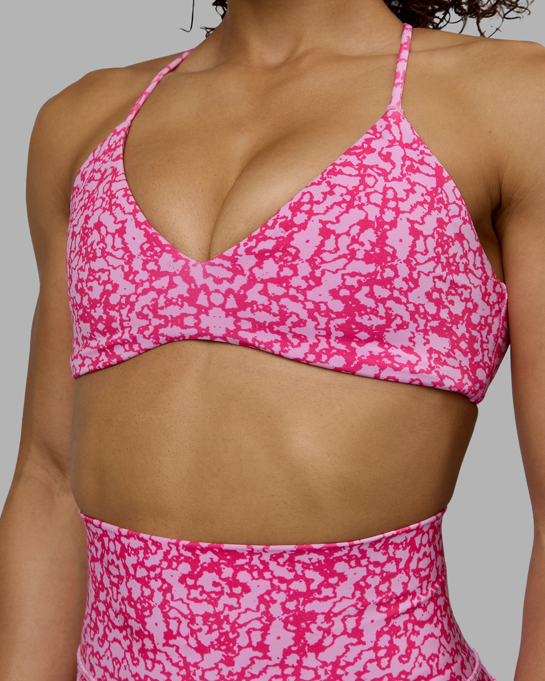 Woman wearing Aura Sports Bra - Patina-Ultra Pink