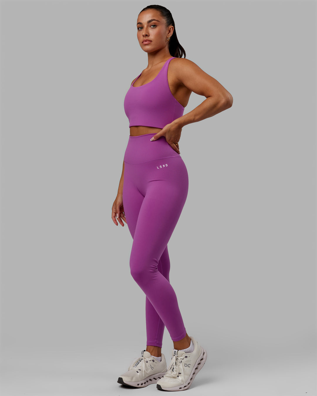 Woman wearing Base 2.0 Full Length Tights - Hyper Violet