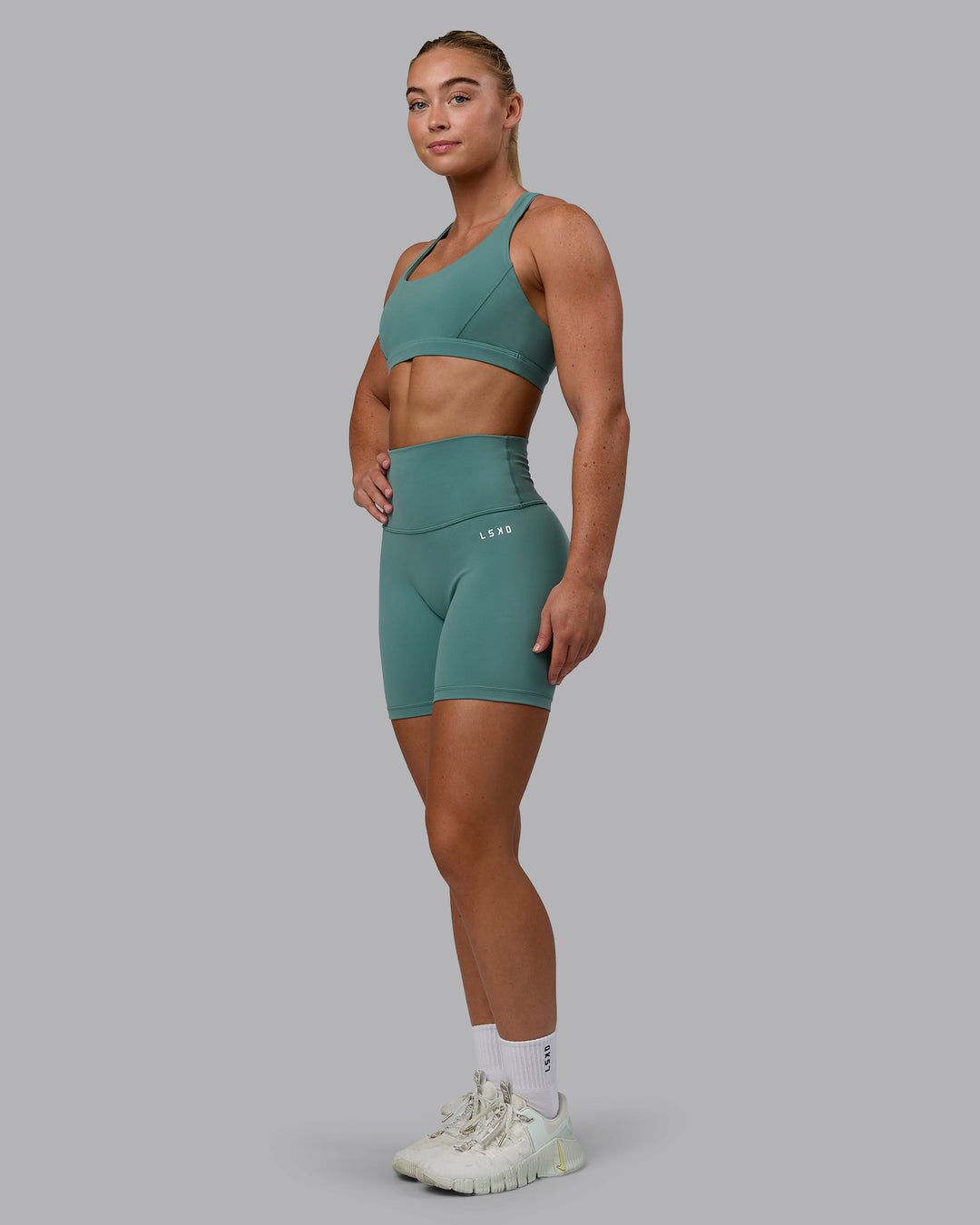 Woman wearing Base 2.0 Mid Short Tights - Sagebrush