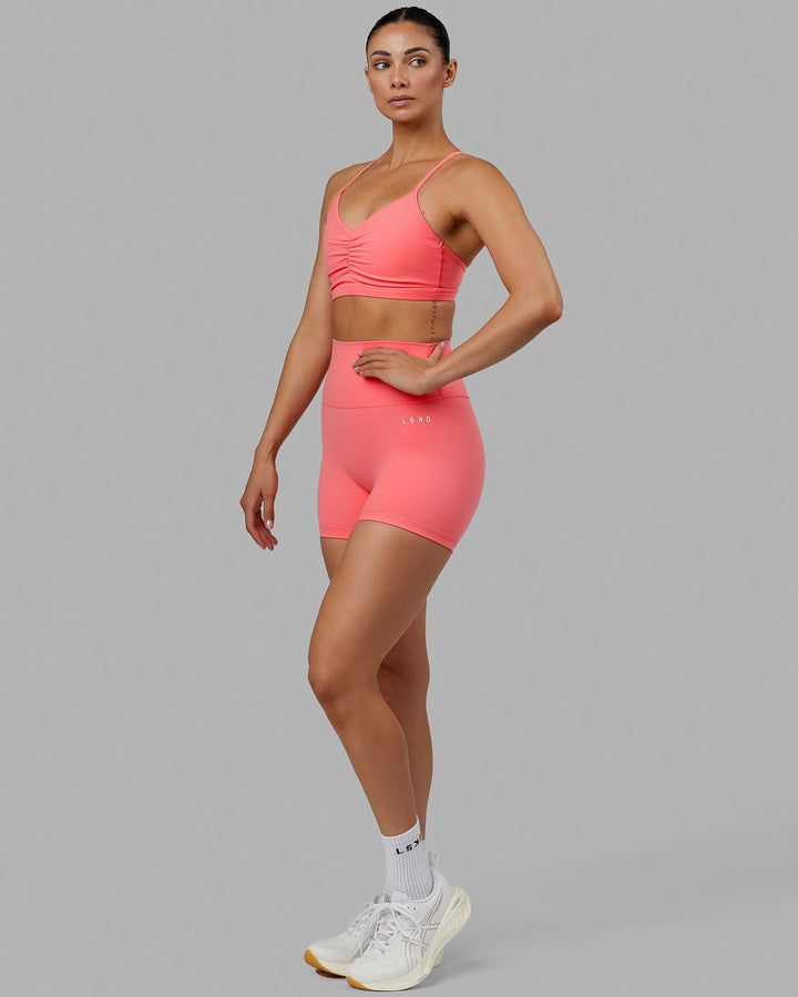 Woman wearing Base 2.0 X-Short Tights - Coral
