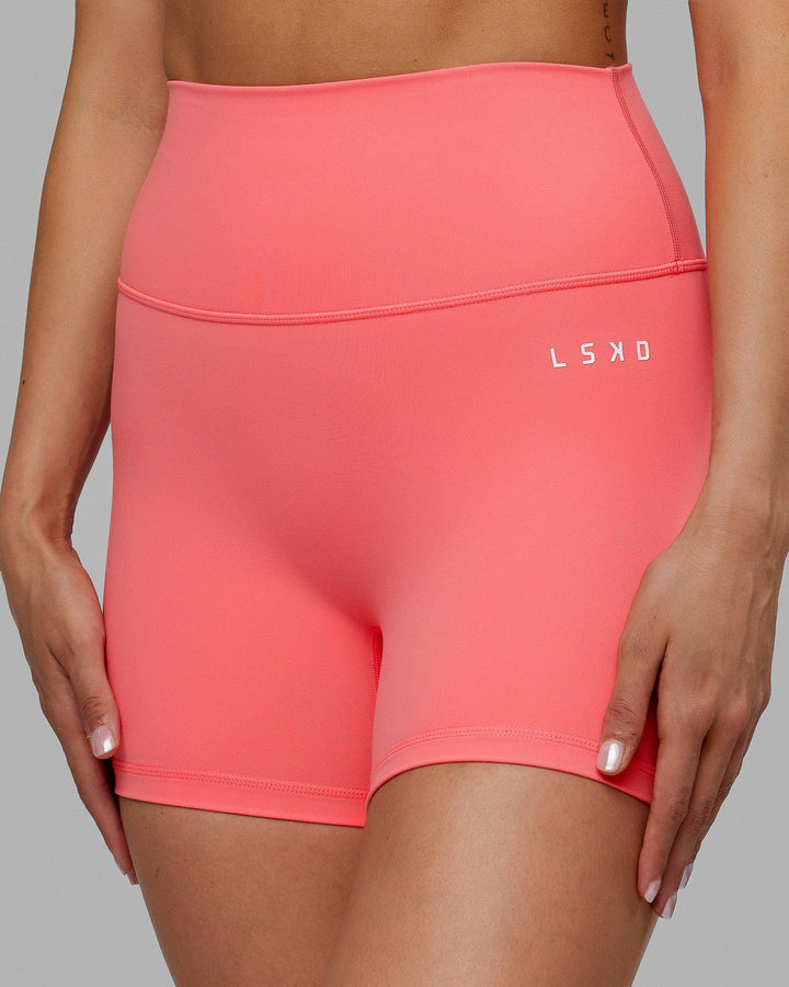 Woman wearing Base 2.0 X-Short Tights - Coral
