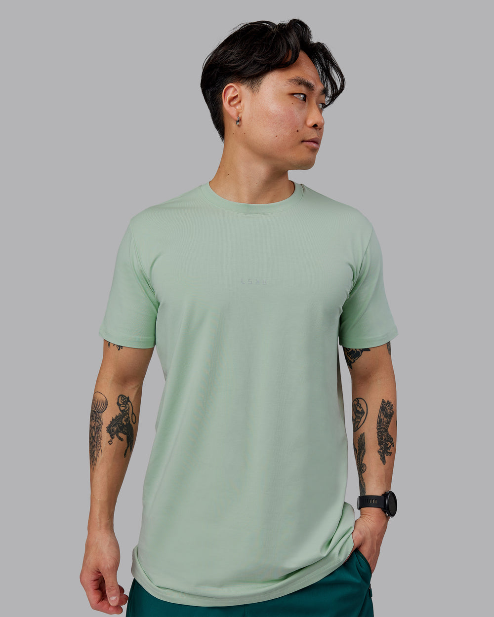 Man wearing Base FLXCotton Tee - Surf Spray