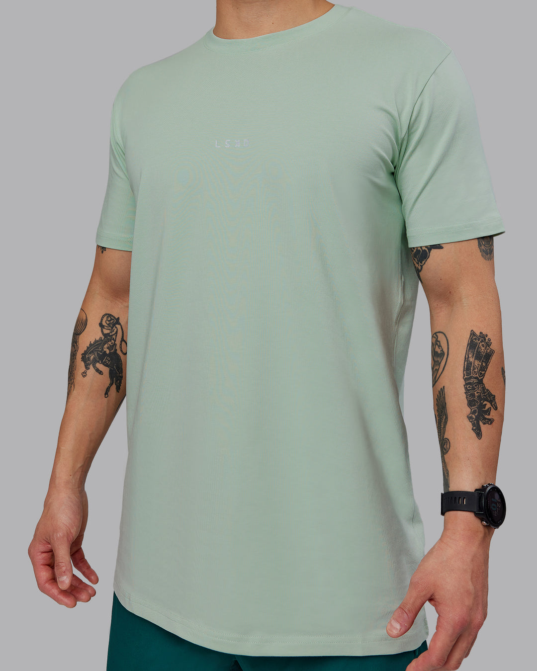 Man wearing Base FLXCotton Tee - Surf Spray