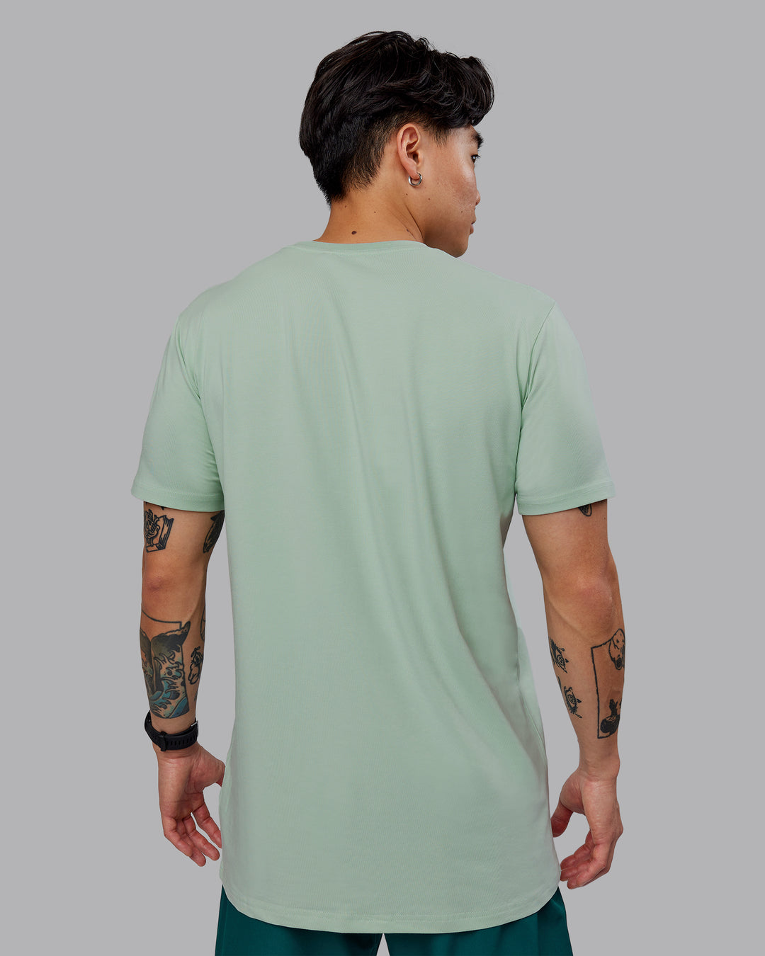 Man wearing Base FLXCotton Tee - Surf Spray