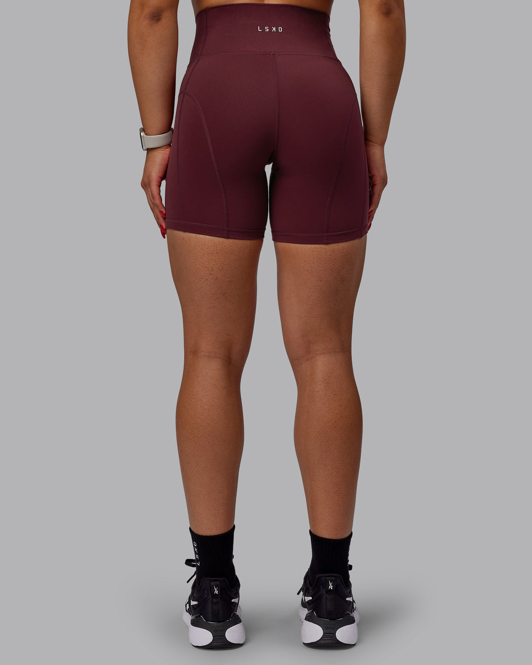 Woman wearing Bend Mid Short Tight - Dark Cherry