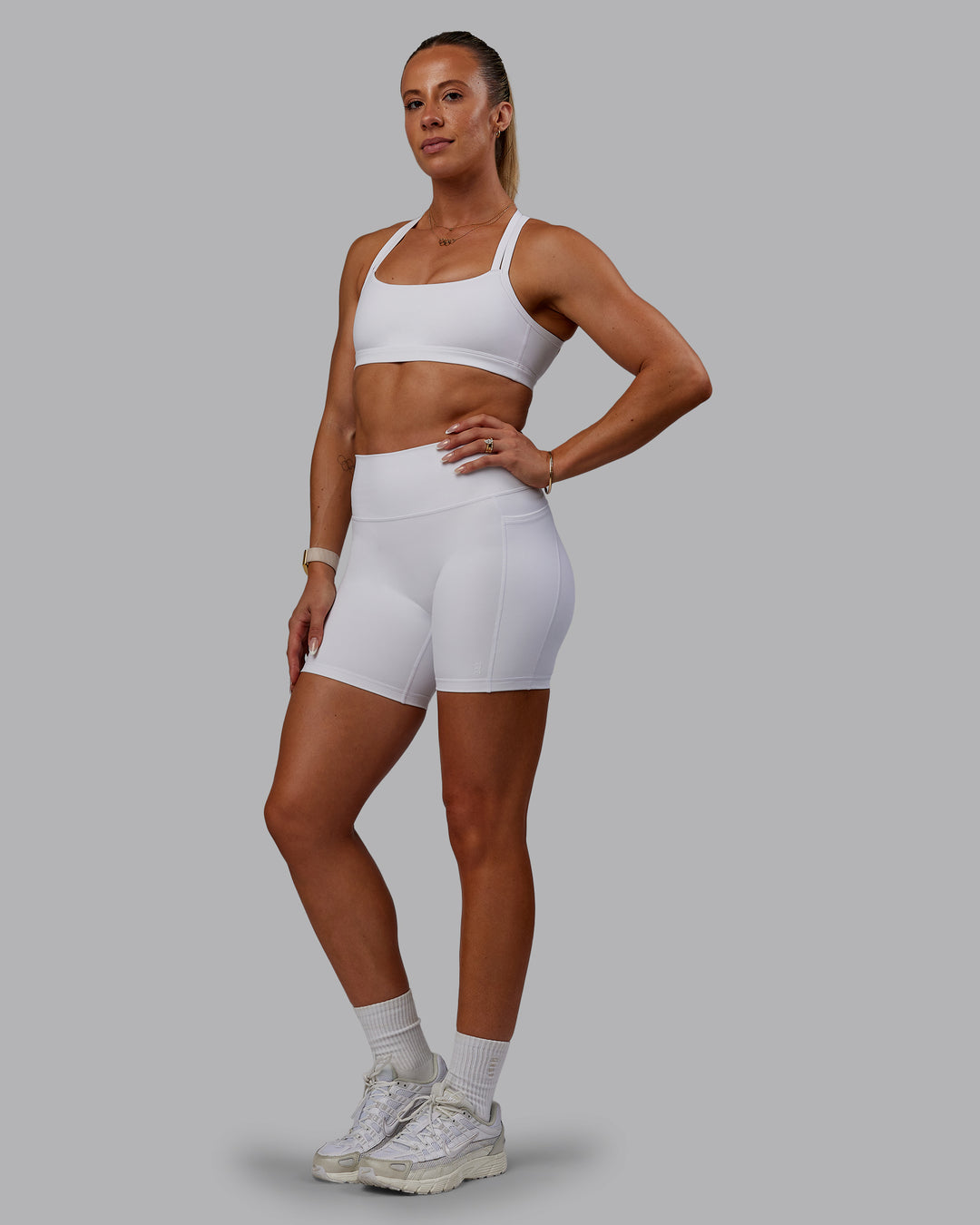 Woman wearing Bree Masters Fusion Mid Short Tights with Pockets - White