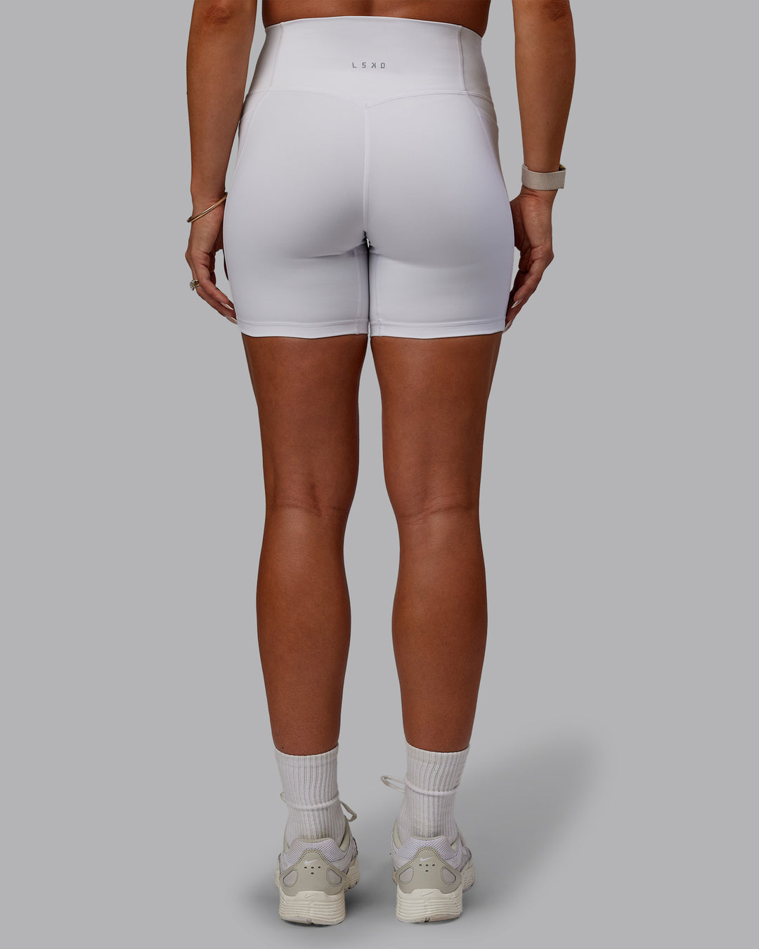 Woman wearing Bree Masters Fusion Mid Short Tights with Pockets - White