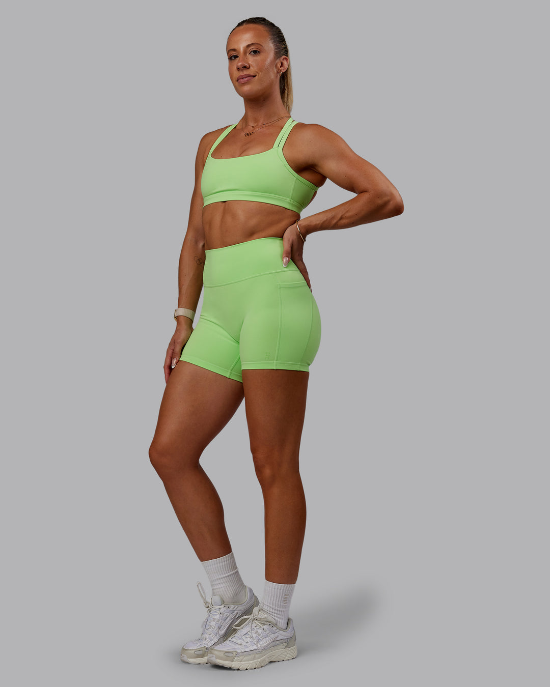 Woman wearing Bree Masters Fusion X-Short Tights with Pockets - Pastel Lime