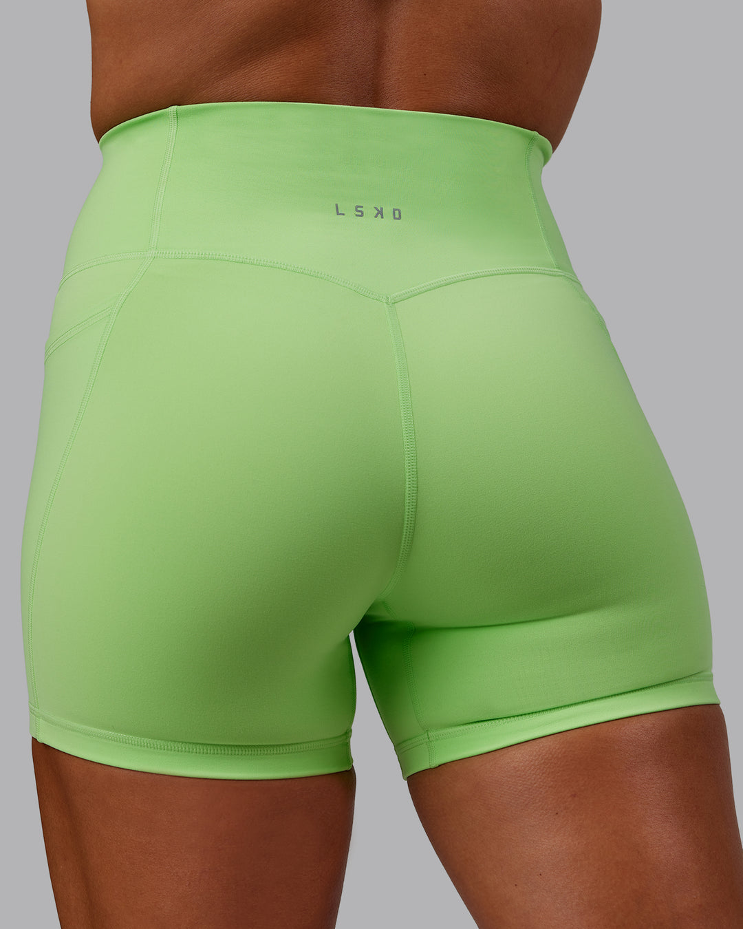 Woman wearing Bree Masters Fusion X-Short Tights with Pockets - Pastel Lime