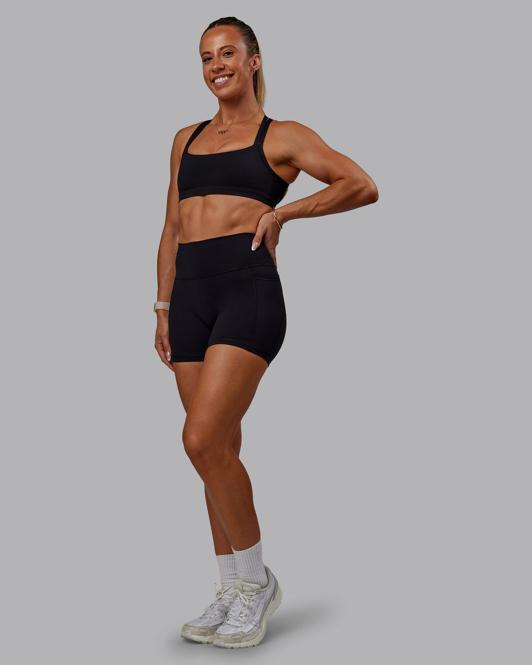 Woman wearing Bree Masters Velocity Sports Bra - Black