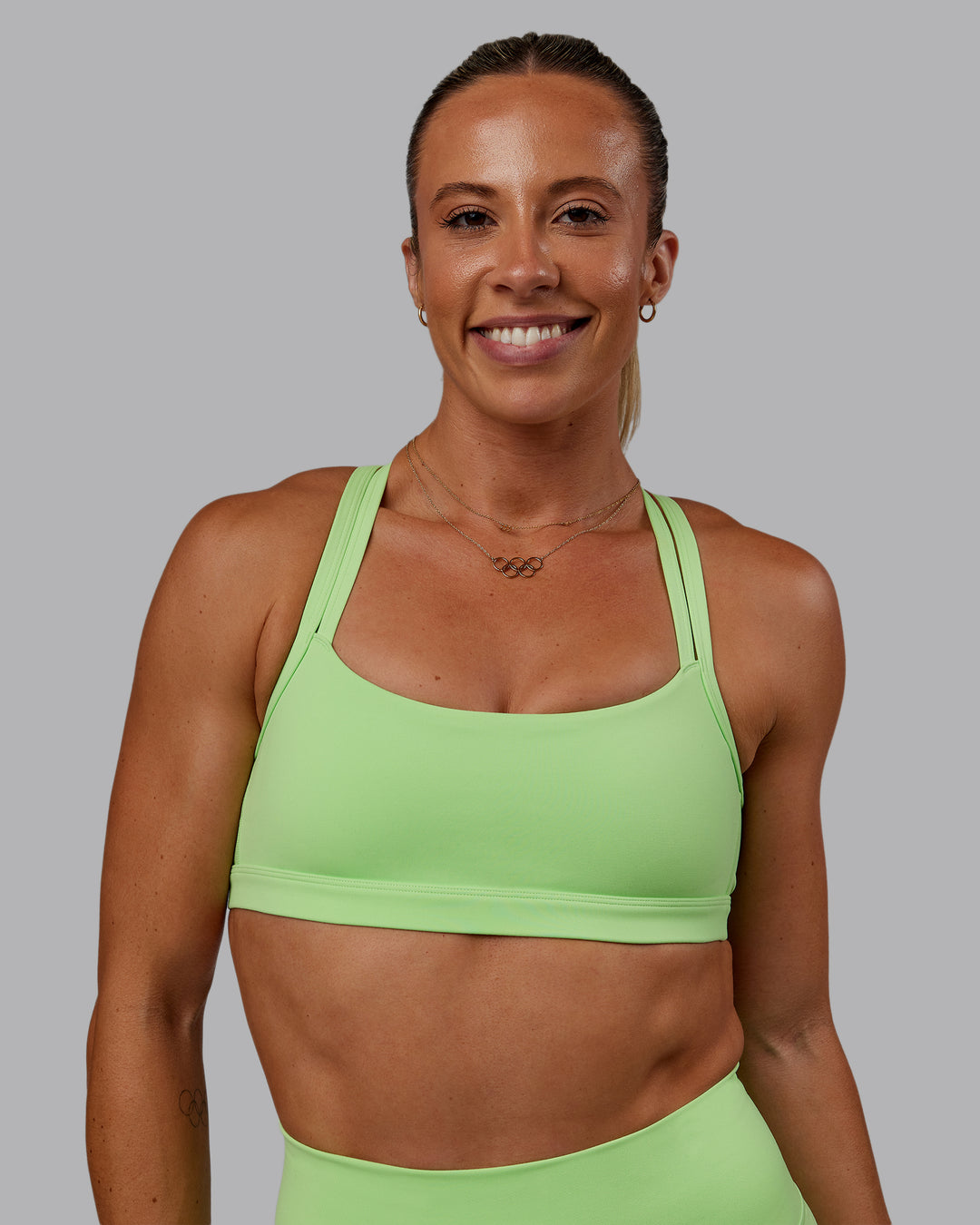 Woman wearing Bree Masters Velocity Sports Bra - Pastel Lime