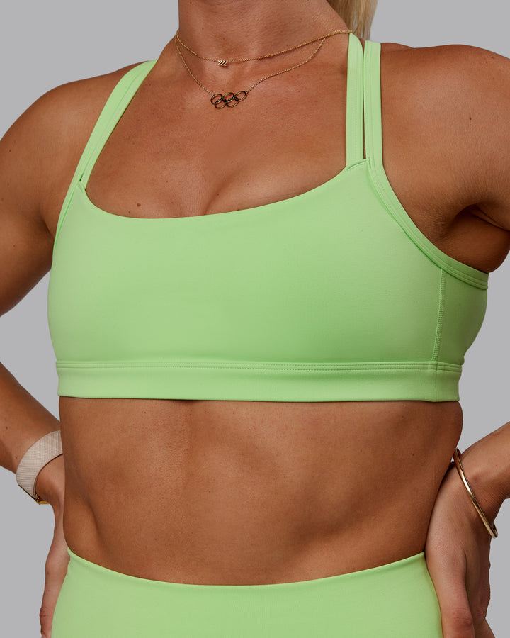 Woman wearing Bree Masters Velocity Sports Bra - Pastel Lime
