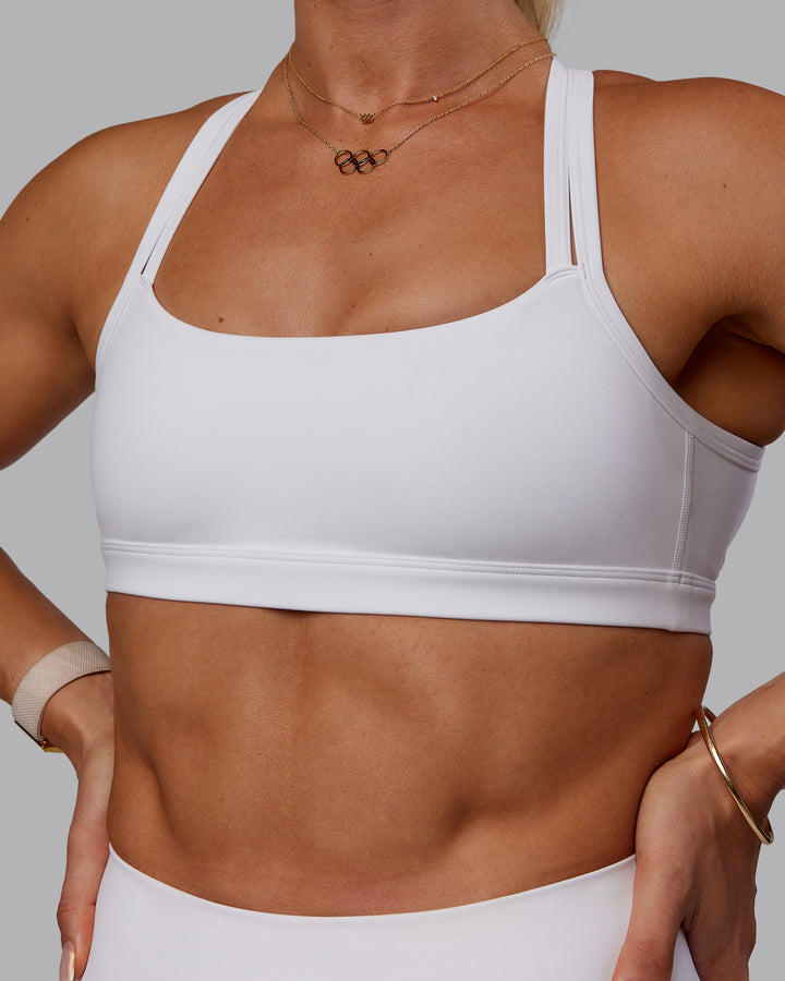 Woman wearing Bree Masters Velocity Sports Bra - White
