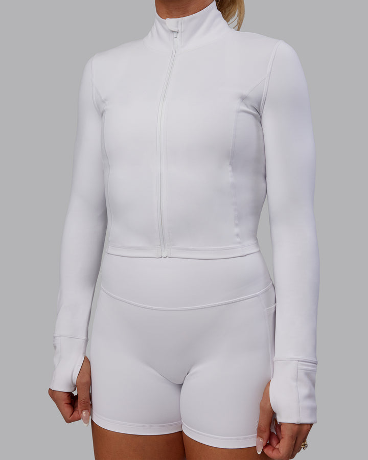 Woman wearing Bree Masters Stride Zip Through Cropped Jacket - White
