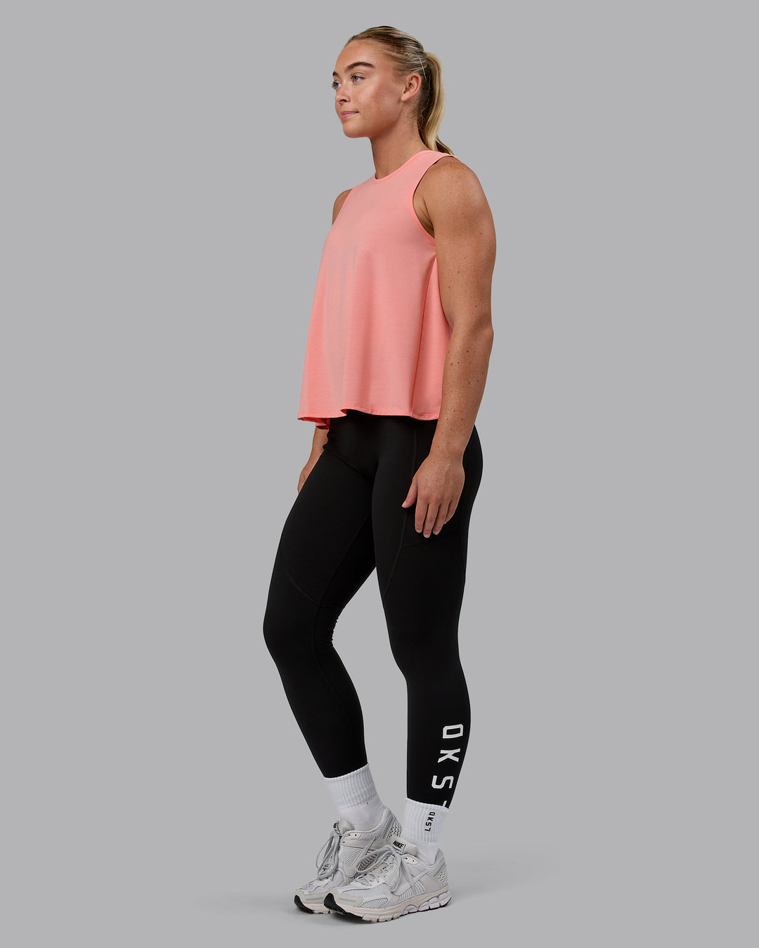 Woman wearing Breeze Training Tank - Murex Shell