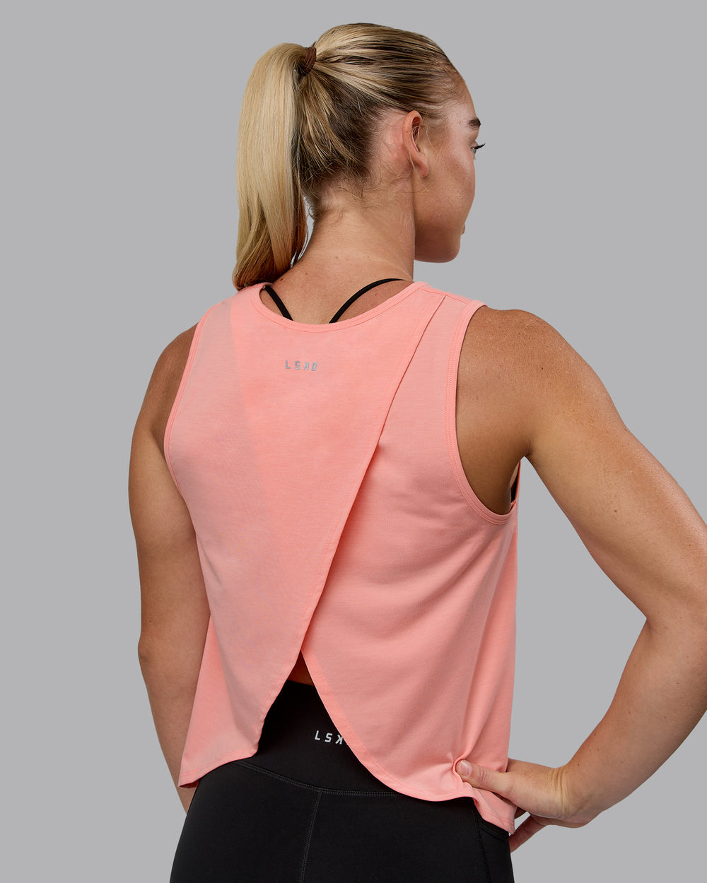 Woman wearing Breeze Training Tank - Murex Shell