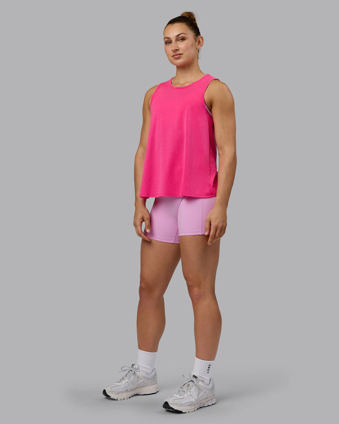 Woman wearing Breeze Training Tank - Ultra Pink