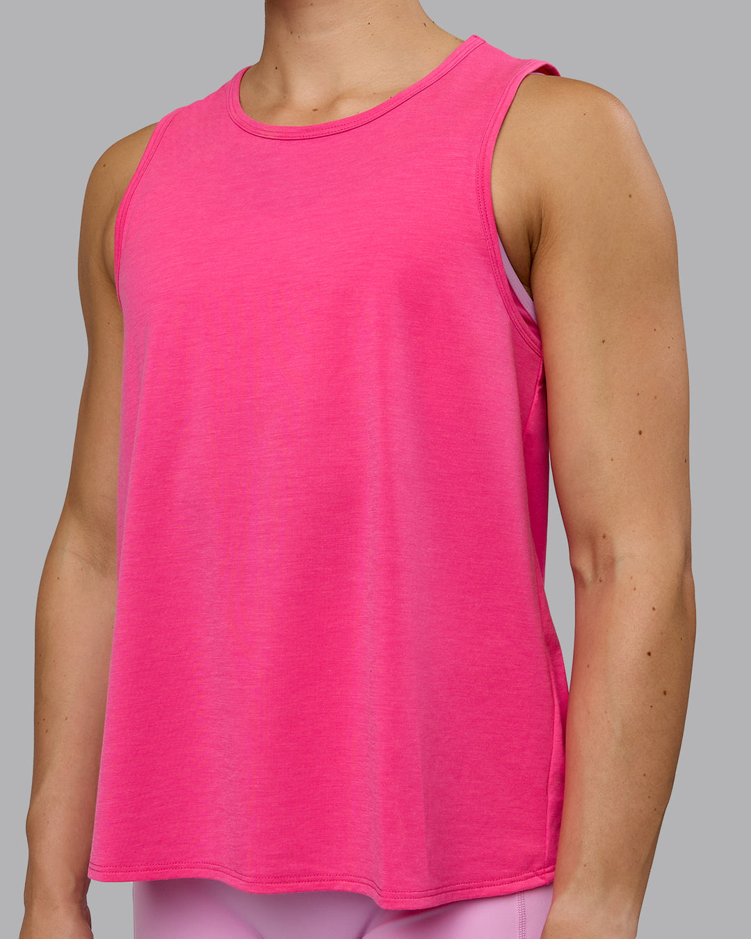 Woman wearing Breeze Training Tank - Ultra Pink