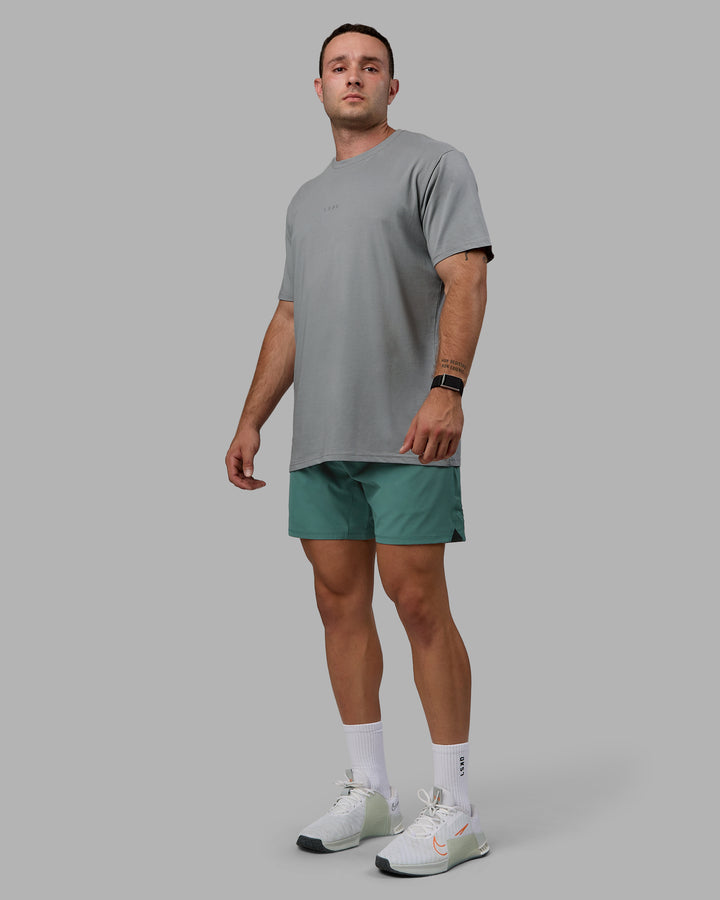 Man wearing Challenger 6&quot; Lined Performance Shorts - Sagebrush
