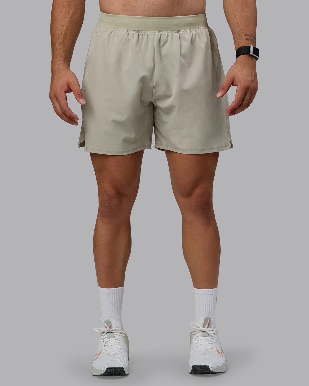 Man wearing Challenger 6&quot; Lined Performance Shorts - Sustained Grey