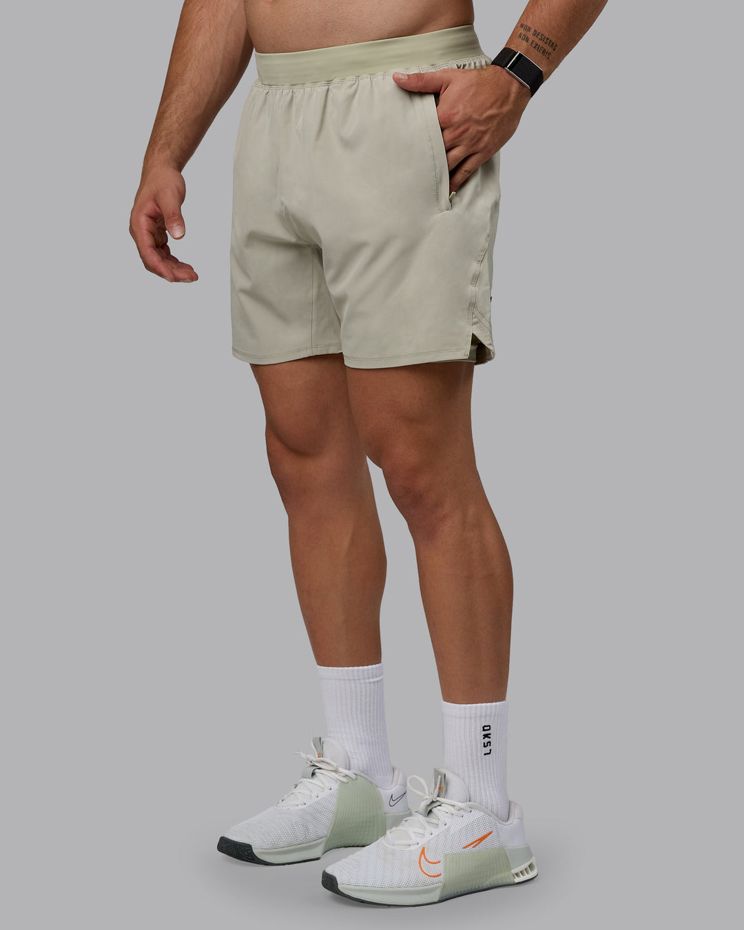 Man wearing Challenger 6&quot; Lined Performance Shorts - Sustained Grey