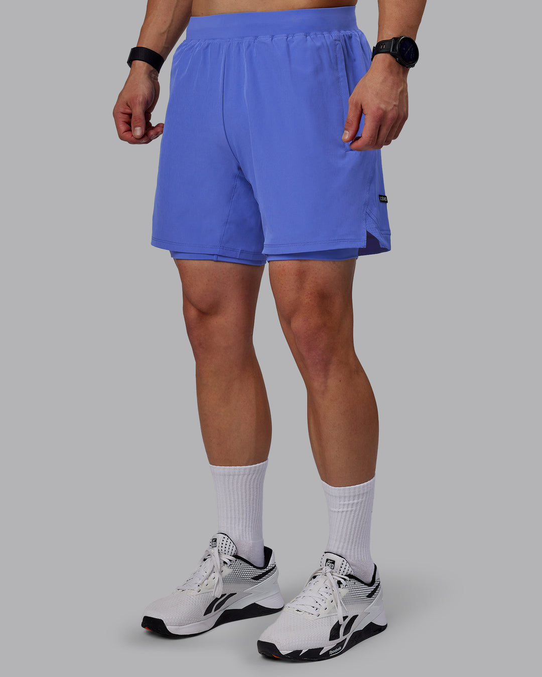 Man wearing Challenger 6&quot; Lined Performance Shorts - Baja Blue