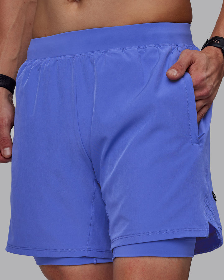 Man wearing Challenger 6&quot; Lined Performance Shorts - Baja Blue
