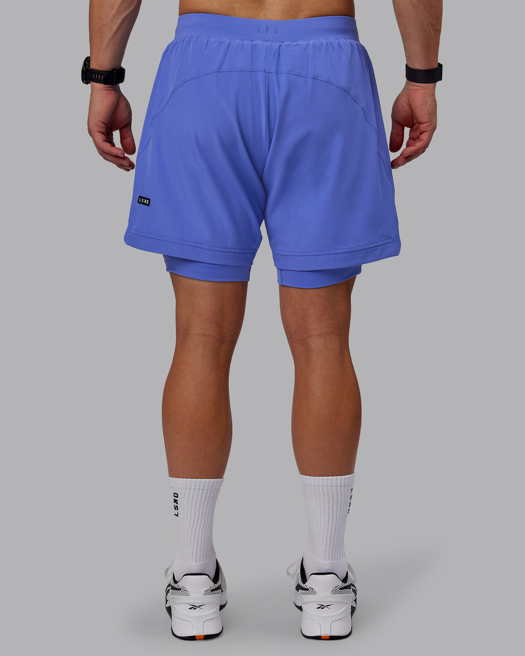 Man wearing Challenger 6&quot; Lined Performance Shorts - Baja Blue