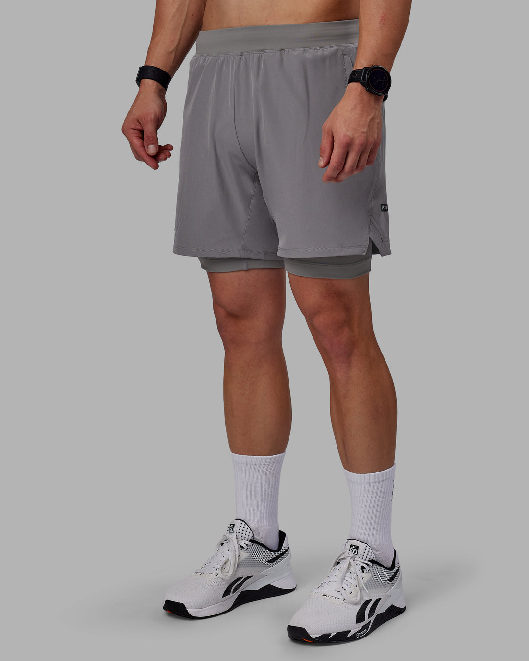 Man wearing Challenger 6&quot; Lined Performance Shorts - Storm Front