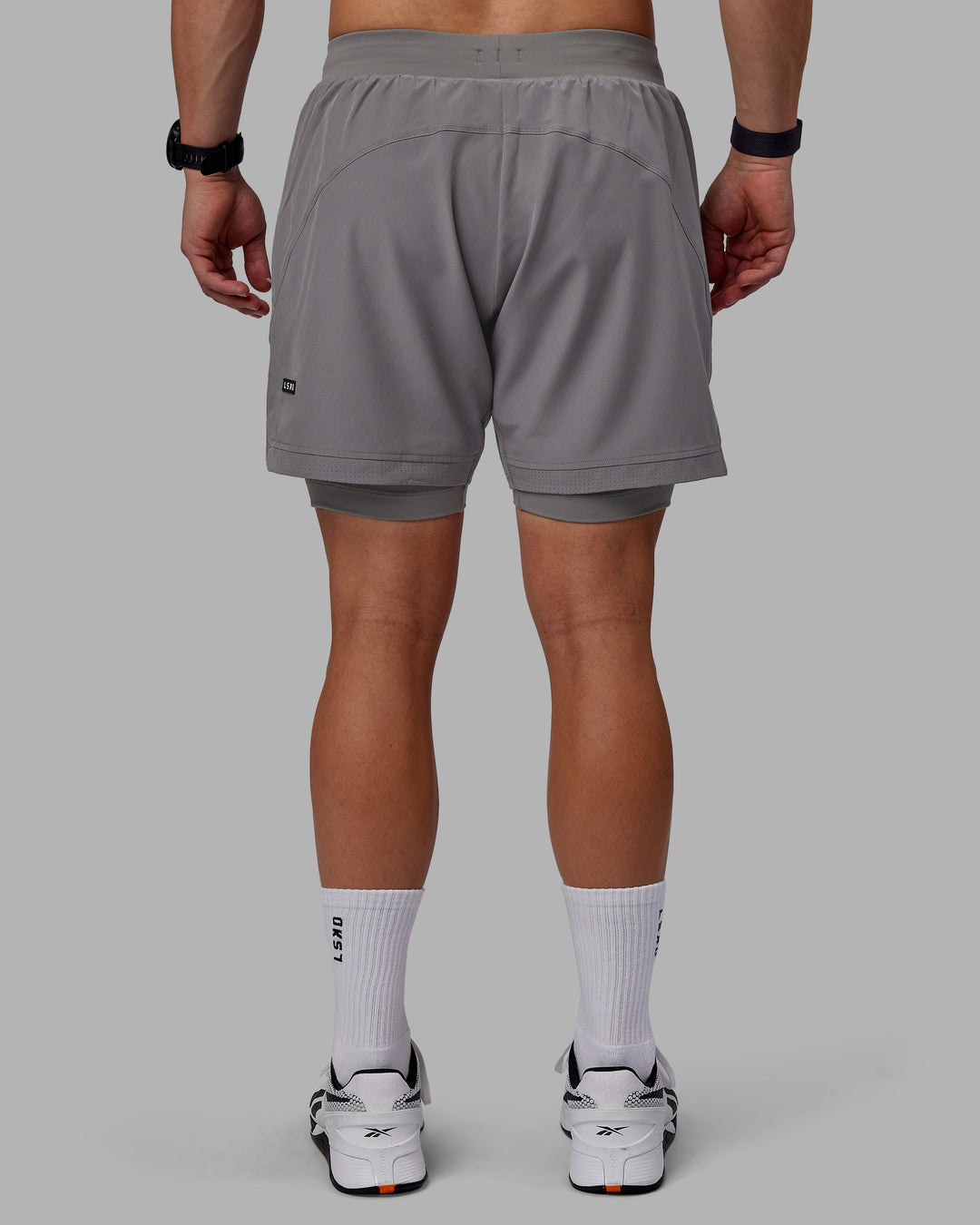 Man wearing Challenger 6&quot; Lined Performance Shorts - Storm Front