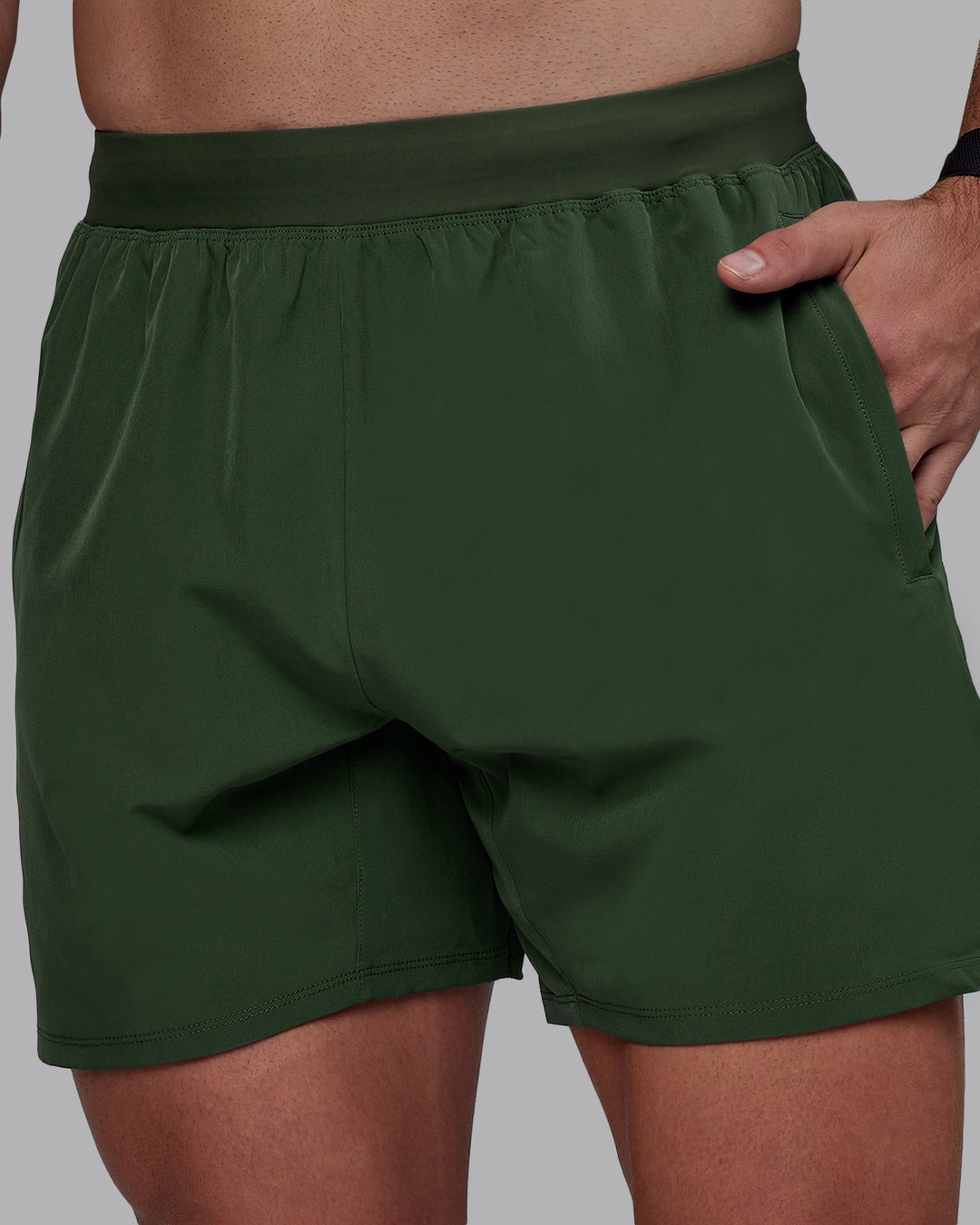 Man wearing Challenger 6&quot; Performance Shorts - Cilantro