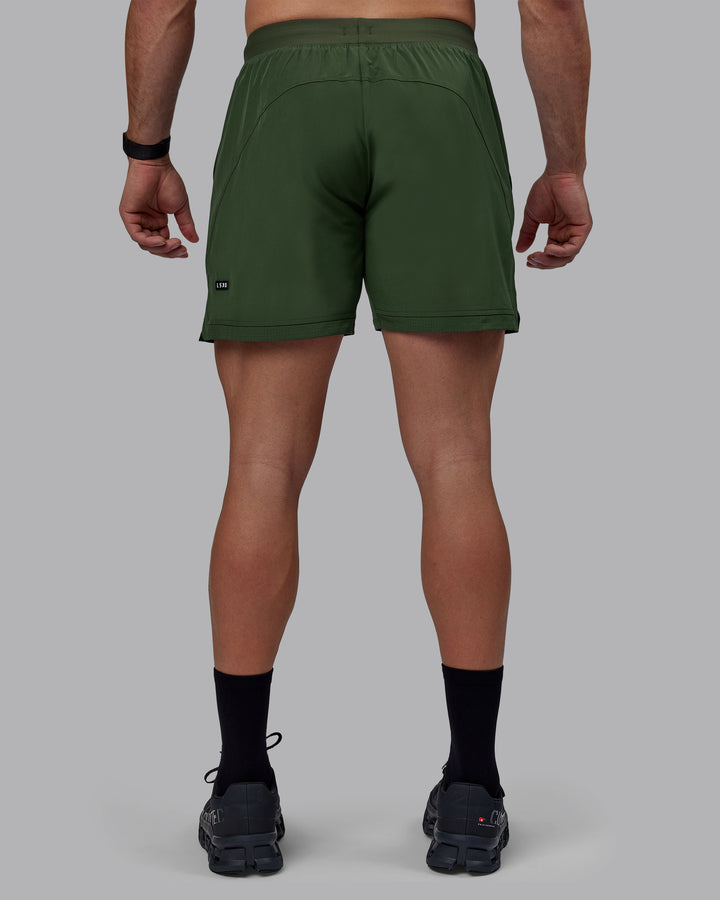 Man wearing Challenger 6&quot; Performance Shorts - Cilantro
