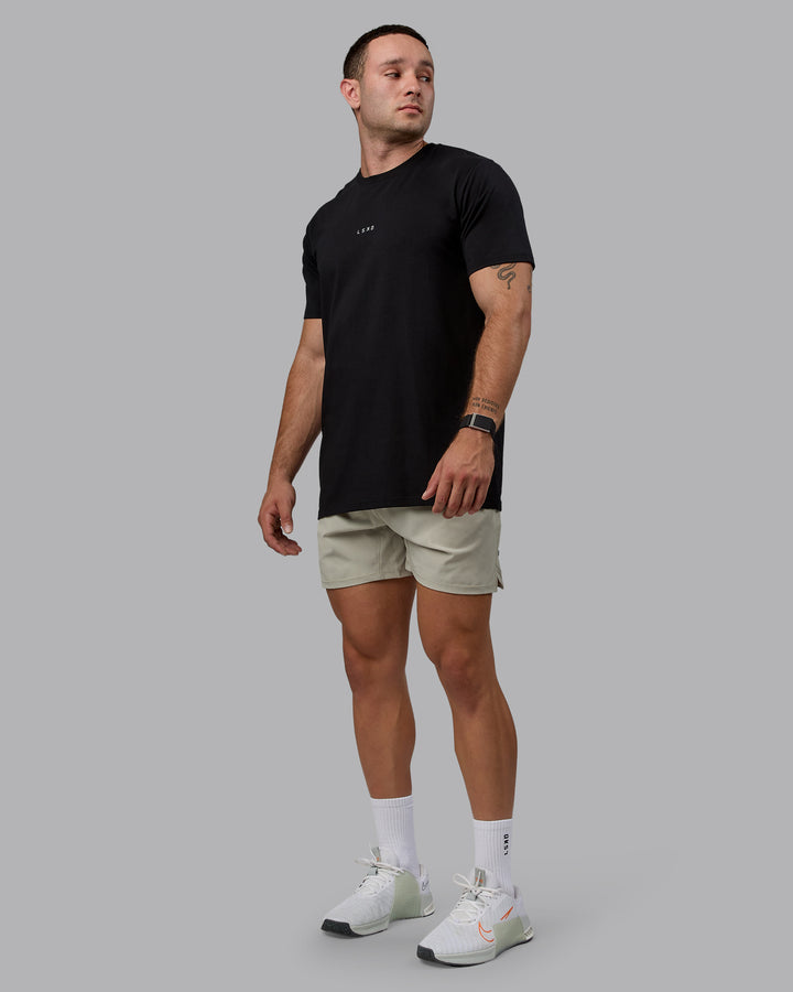 Man wearing Challenger 6&quot; Performance Shorts - Sustained Grey
