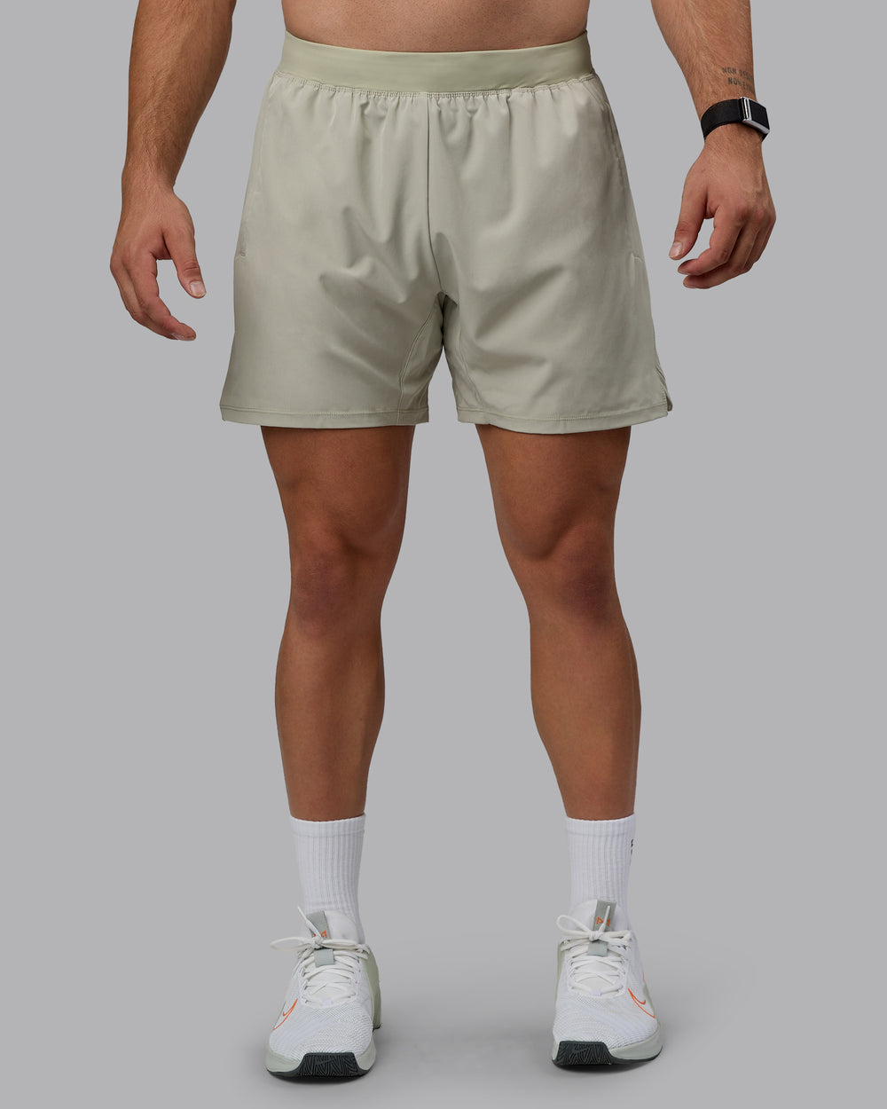 Man wearing Challenger 6" Performance Shorts - Sustained Grey