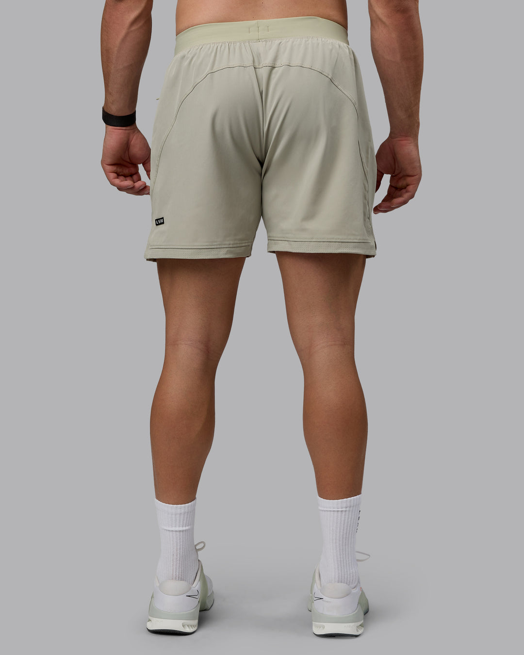 Man wearing Challenger 6&quot; Performance Shorts - Sustained Grey