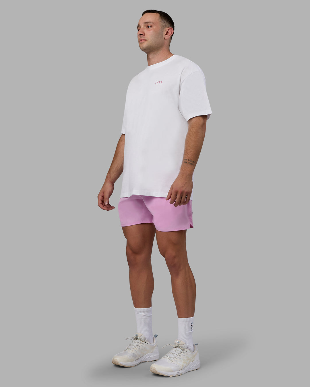 Man wearing Challenger 6&quot; Performance Shorts - Pastel Orchid