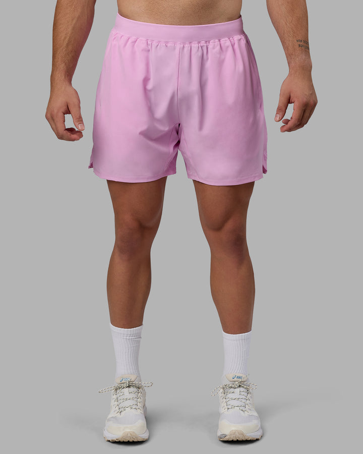 Man wearing Challenger 6&quot; Performance Shorts - Pastel Orchid
