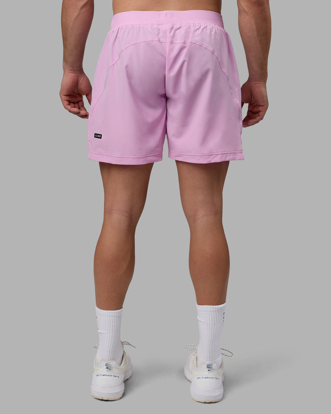 Man wearing Challenger 6&quot; Performance Shorts - Pastel Orchid