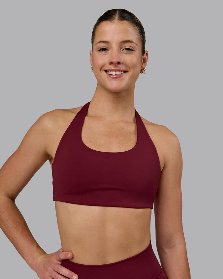 Woman wearing Challenger Sports Bra - Cordovan
